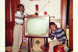 David and Stephen Hunter Black archives book childhood picture David is leaving on the TV and and Stephen is sitting on a toy