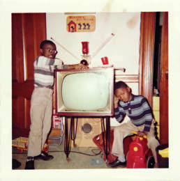 David and Stephen Hunter Black archives book childhood picture David is leaving on the TV and and Stephen is sitting on a toy
